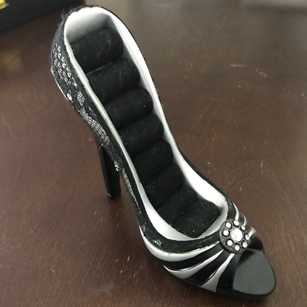 High heeled shoe that holds rings